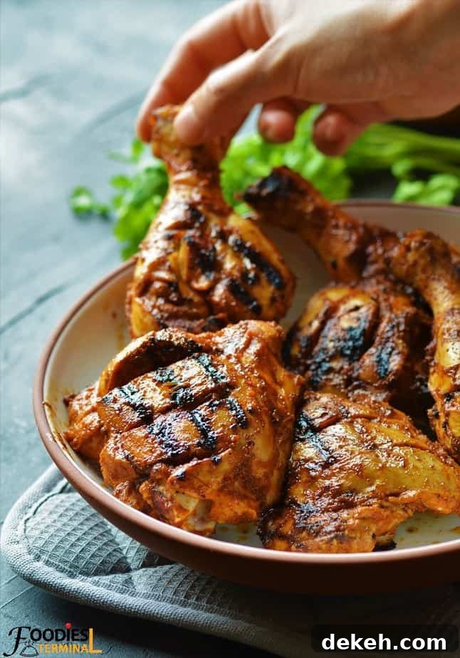 Nando's Peri Peri Chicken being lifted from a bowl