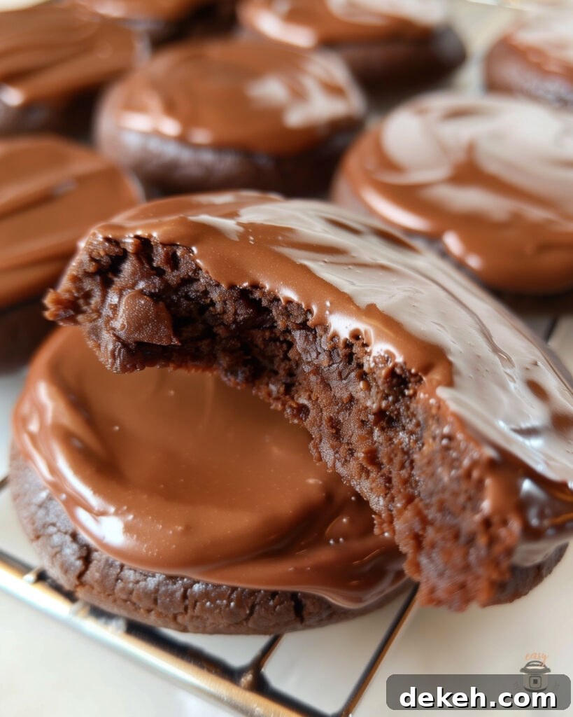 Baked Texas Sheet Cake Cookies arranged on a baking sheet, showcasing their moist texture and glossy chocolate topping.