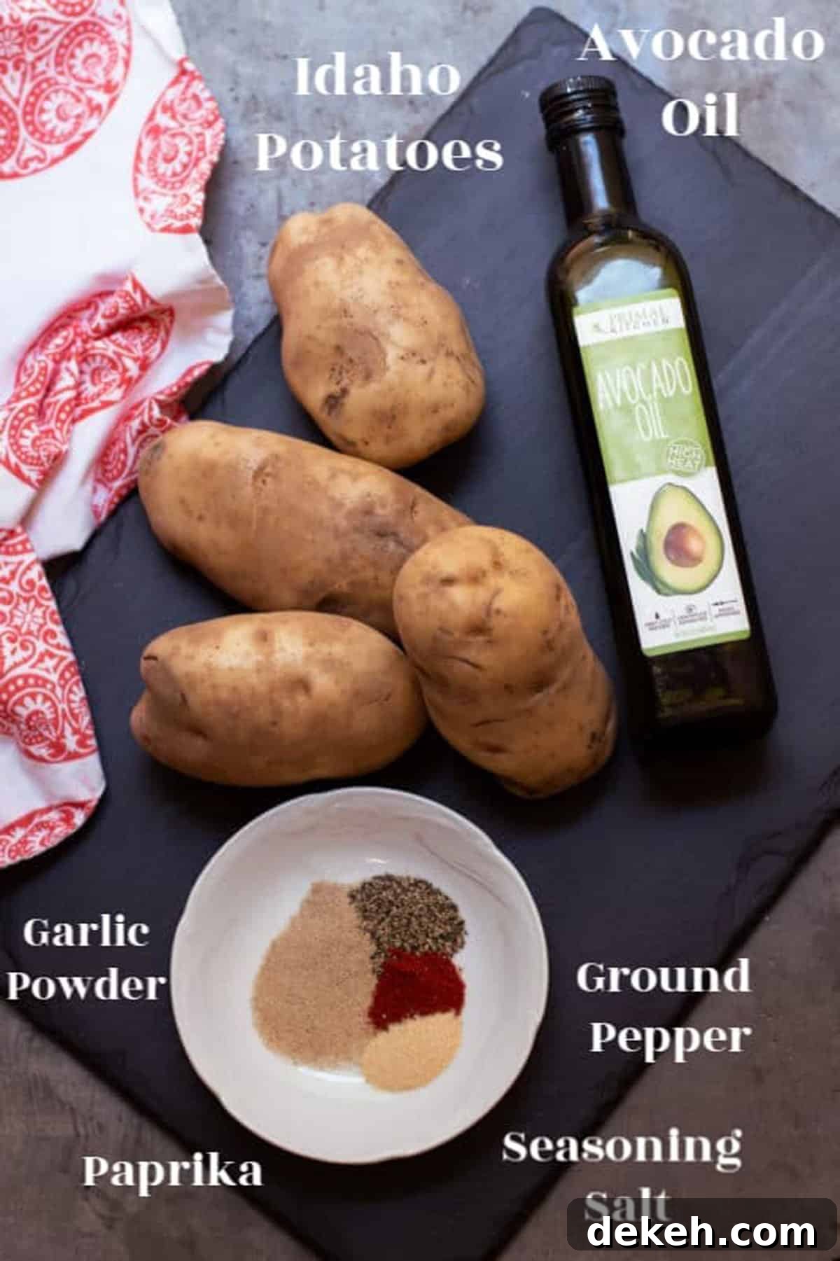 4 potatoes, avocado oil, seasoning on a black platter.