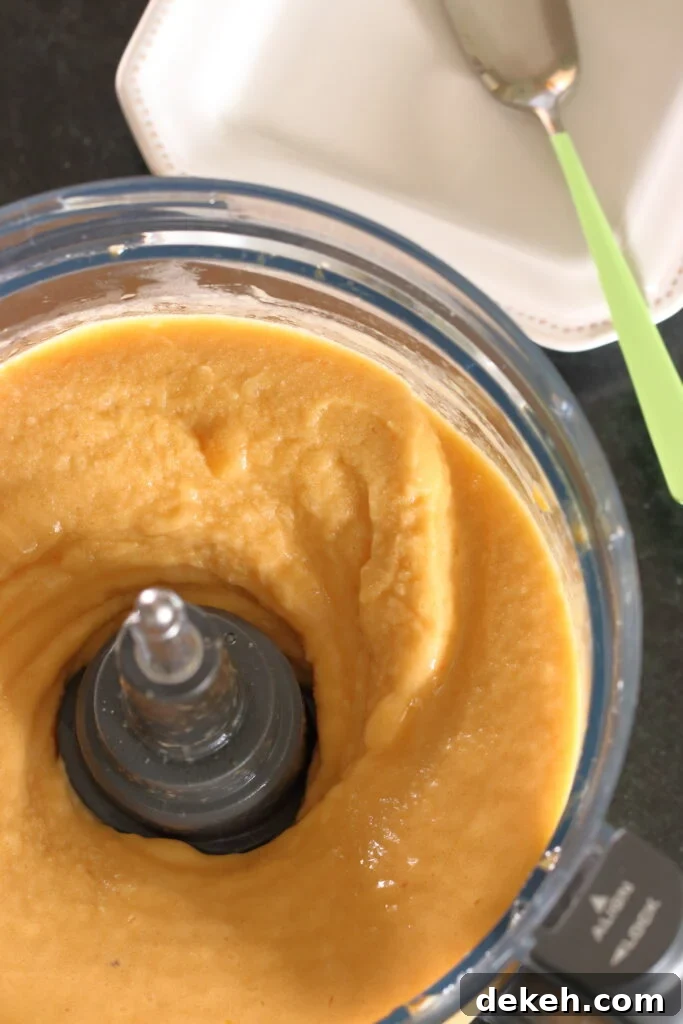 Frozen peaches blended in food processor with frozen banana and a splash of honey simple syrup ready to serve