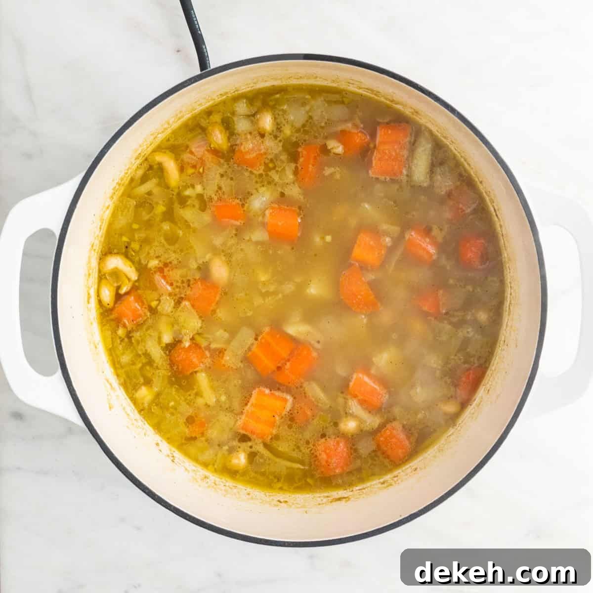 Cooked soup before blending and adding the broccoli and vegan cheese.