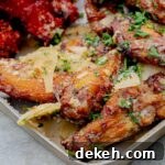 Best Garlic Parmesan Wings on the Grill on a metal baking sheet