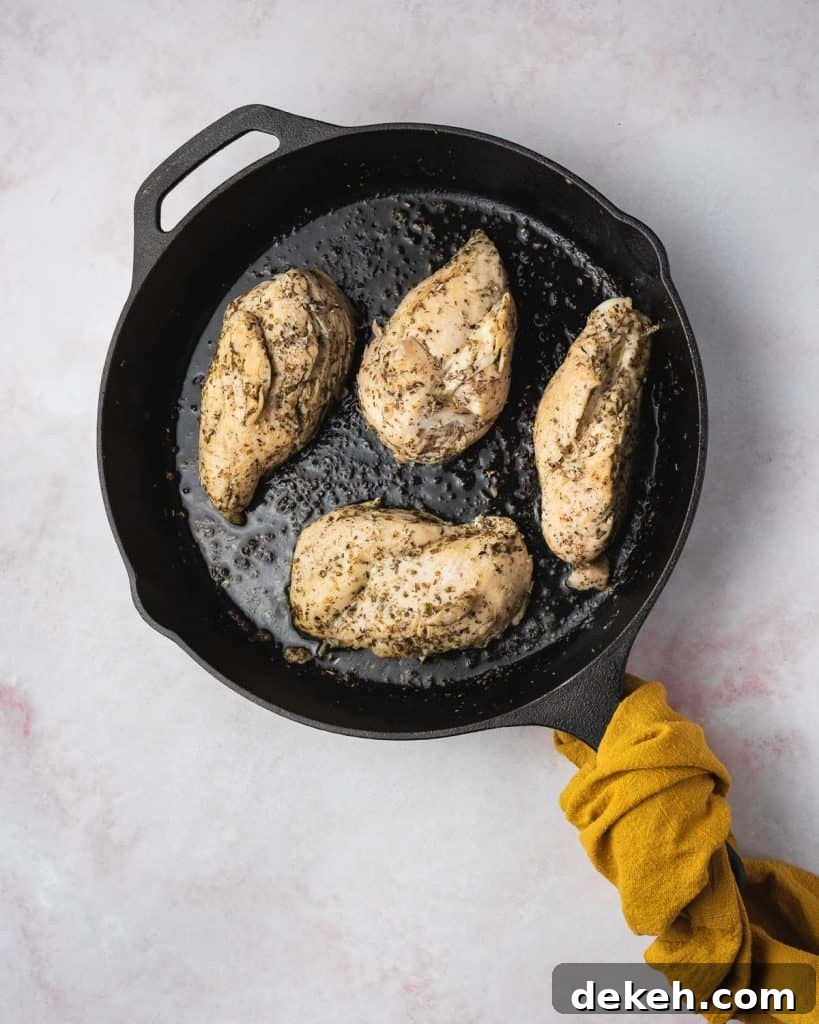 Chicken breasts cooked in a cast iron.
