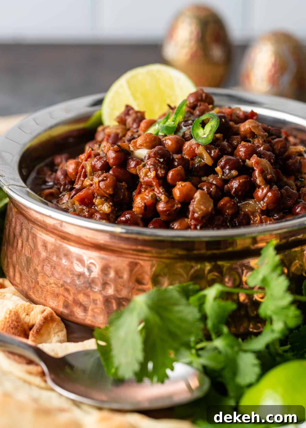 dish of spicy kala chana recipe garnished with green chilies
