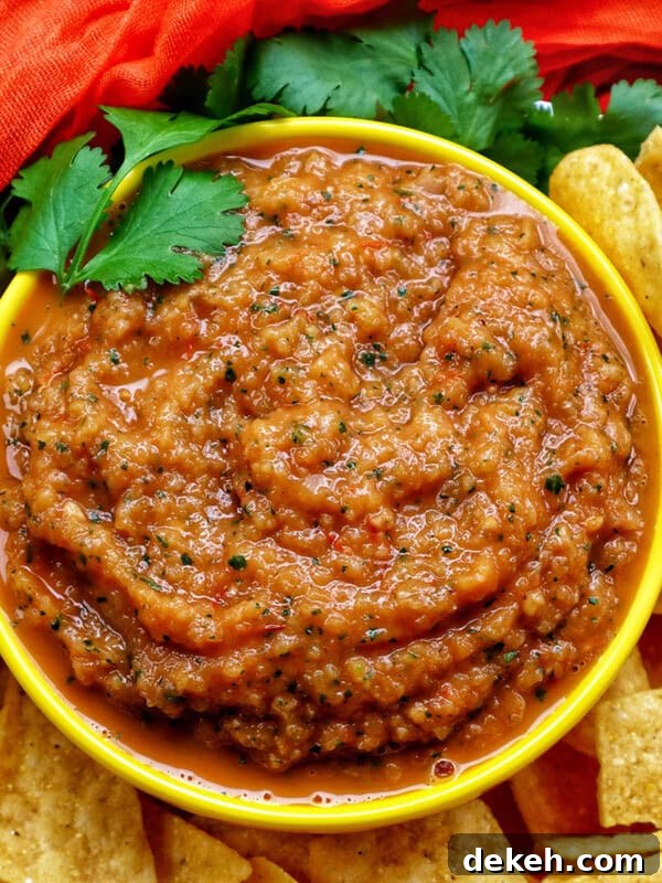 mango habanero salsa in a bowl with tortilla chips.