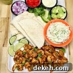 Platter with shrimp tacos and toppings- not assembled.