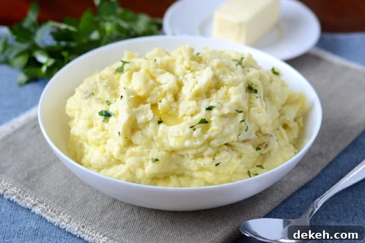 instant pot mashed potatoes with butter in a white bowl