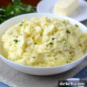 instant pot mashed potatoes with butter in a white bowl