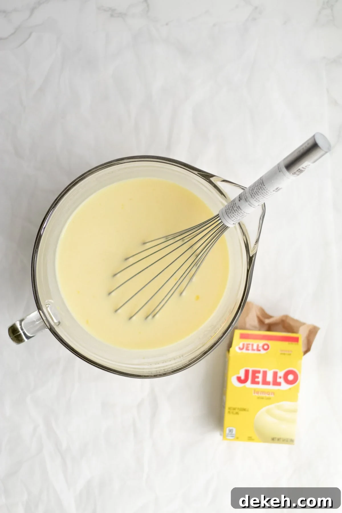 mixing pudding in a glass bowl