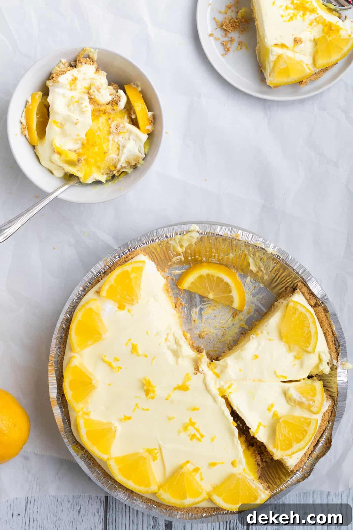 lemon pie sliced with a broken slice in a bowl