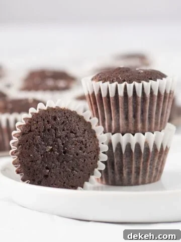 three brownies on a small white plate.
