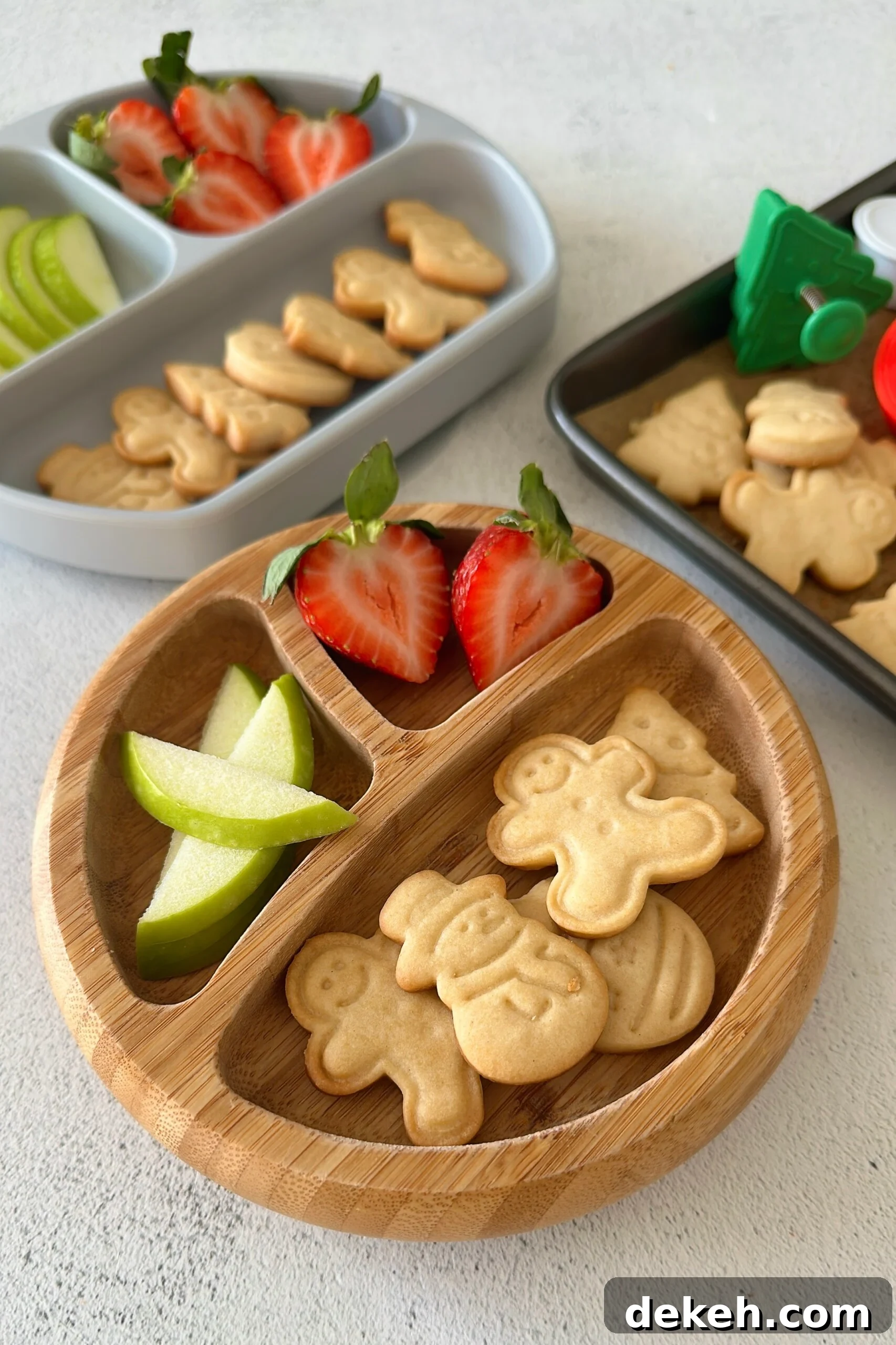 Mini sugar cookies served with fruits.