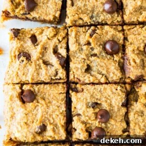 Pumpkin chocolate chip cookie bars cut into pieces.