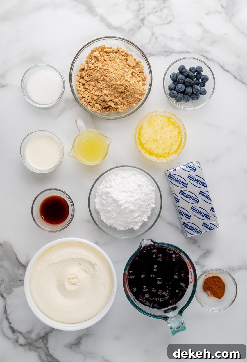 an overhead image showing the measured ingredients needed to make a batch of blueberry cheesecake jars
