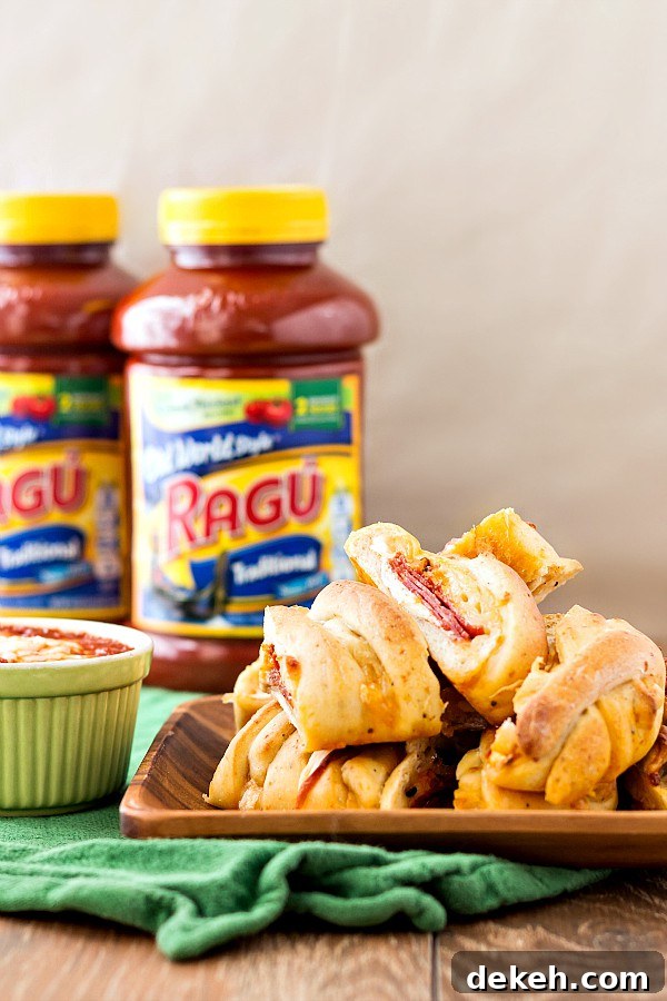 A platter of Homemade pizza bread with jars of Ragu in the background.