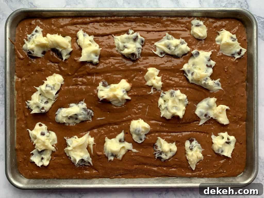 German chocolate cake mix batter with spoonfuls of cream cheese, sugar and chocolate chips