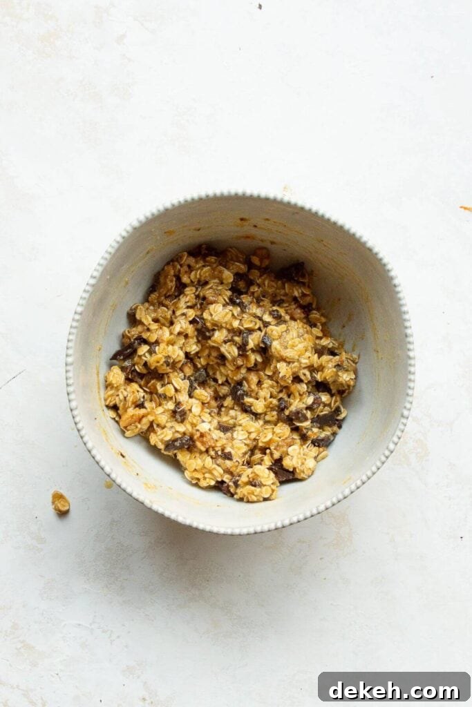 adding chocolate chips and orange zest