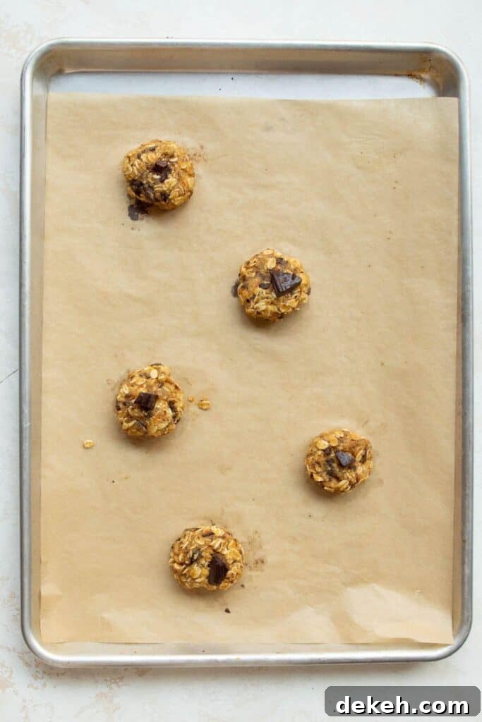 unbaked chocolate chip orange oatmeal cookies on a baking sheet