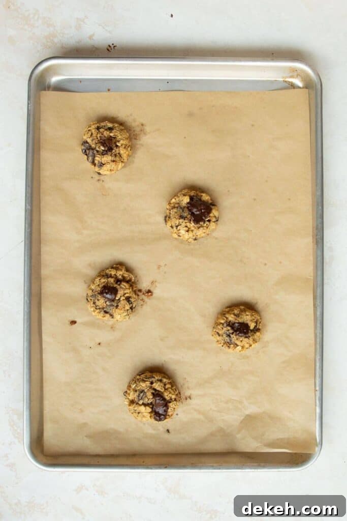 baked chocolate orange oatmeal cookies on a baking sheet