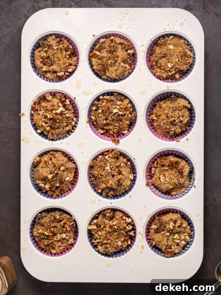 muffin tin with pecan date crumble topping