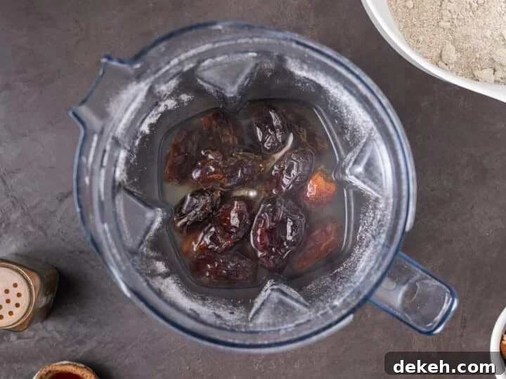 dates covered in water in a blender