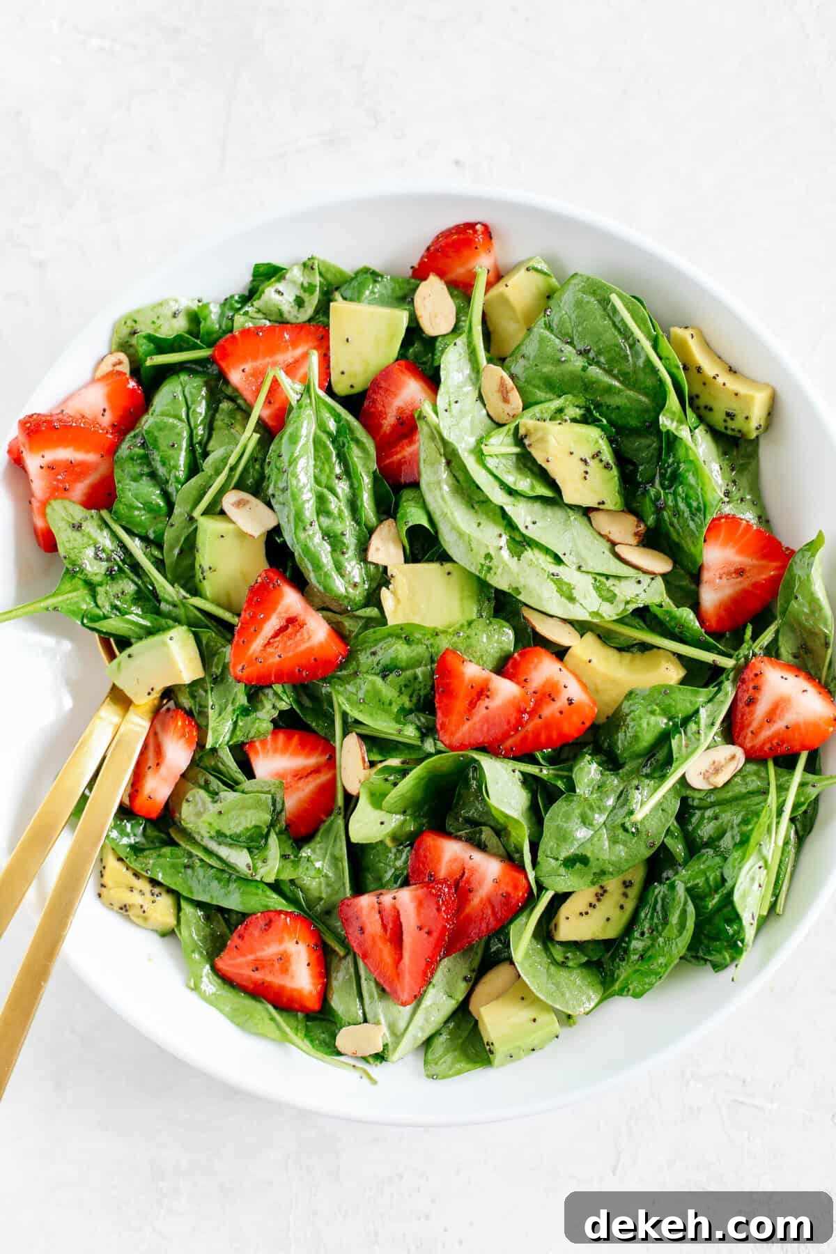 Super simple Strawberry Spinach Salad with Poppy Seed Dressing that is healthy, delicious and the perfect summer staple!