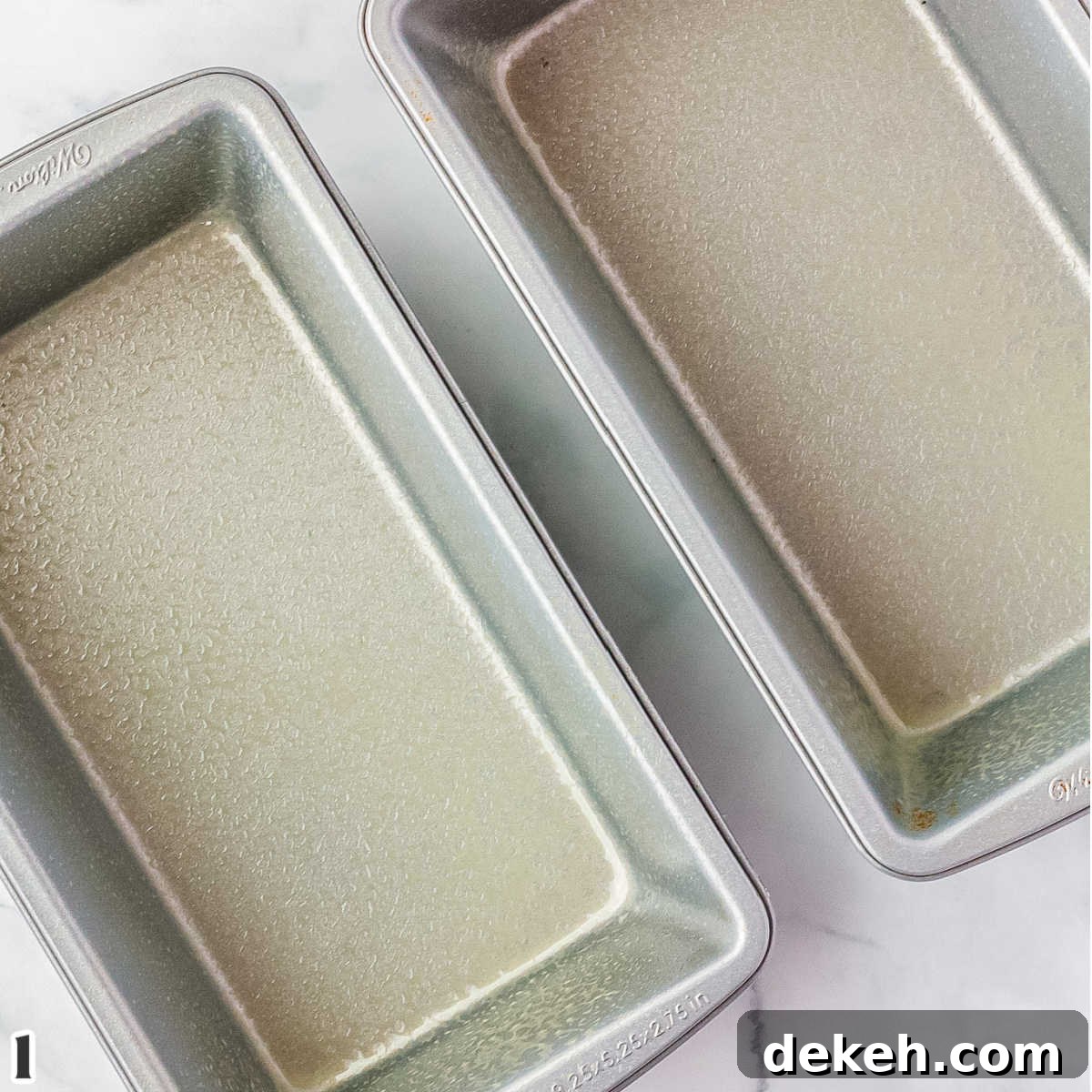 Two loaf pans greased with nonstick cooking spray.