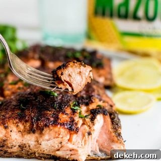 close up of piece of salmon on fork