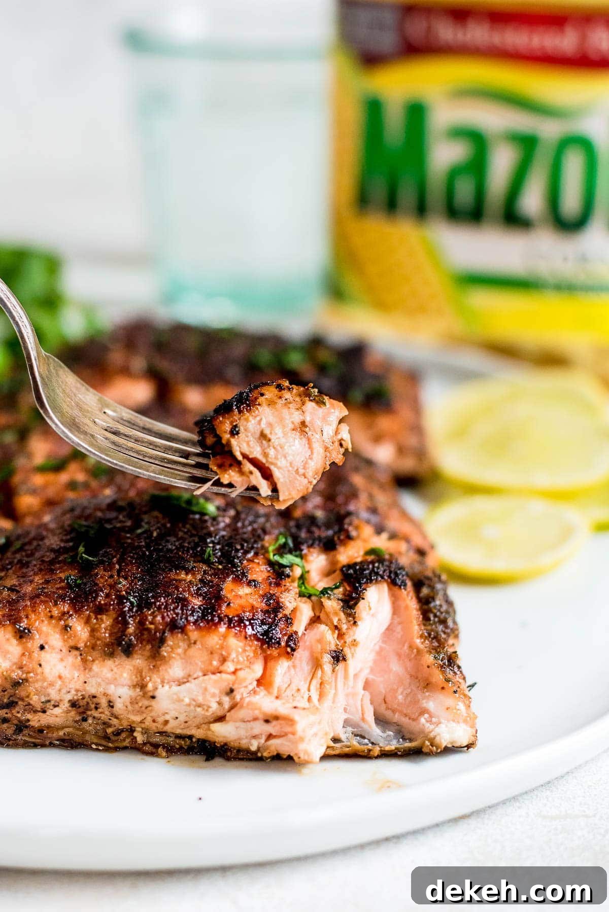 close up of forkful of grilled salmon