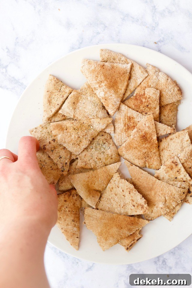 These healthy homemade pita chips are made right in the microwave! They only require two simple ingredients & 5 minutes to make into a crunchy, satisfying snack!