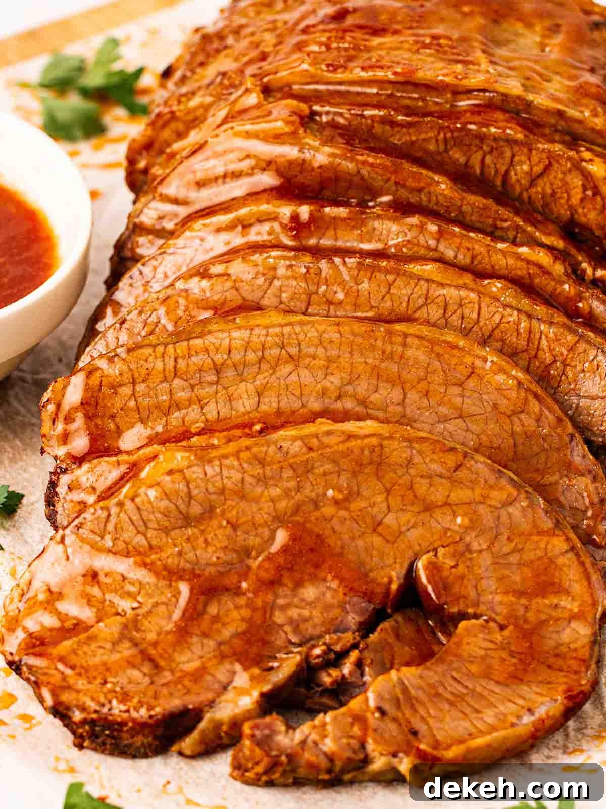 Slices of beef brisket in gravy, ready to be served up.