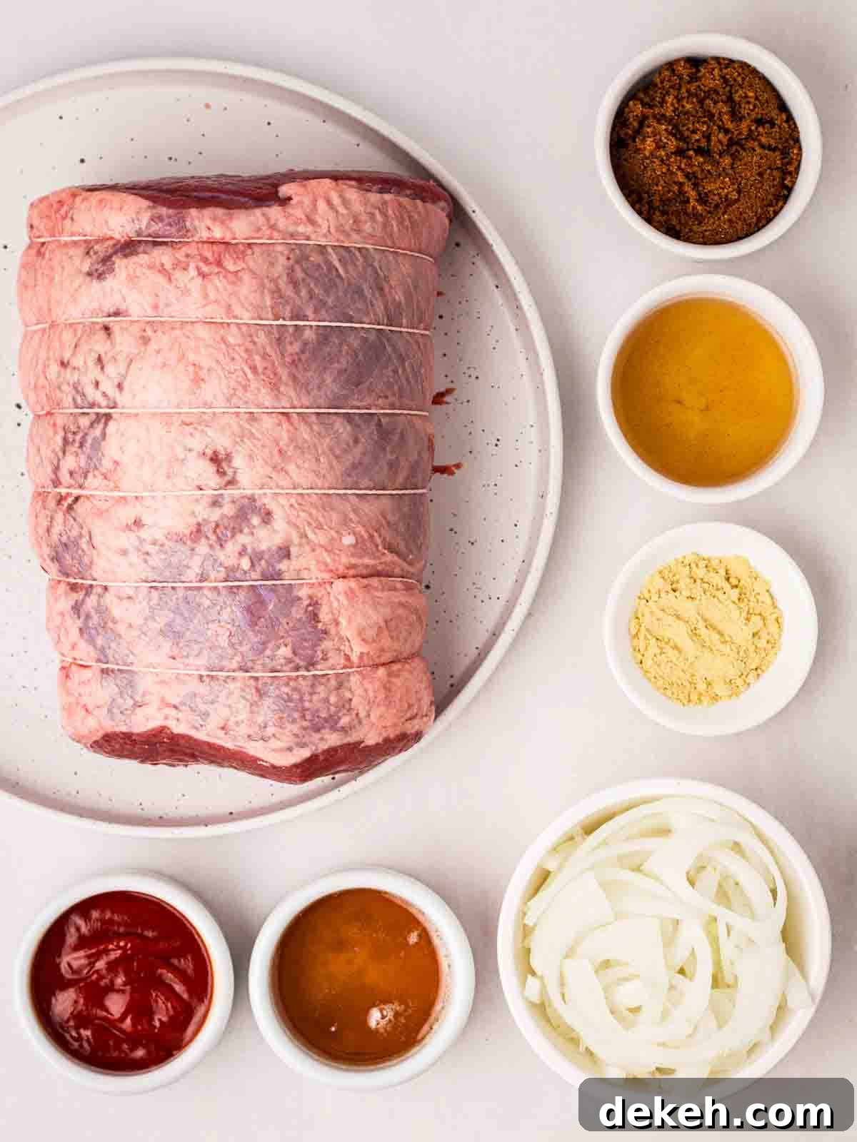 The ingredients for making slow cooker beef brisket laid out on a counter.