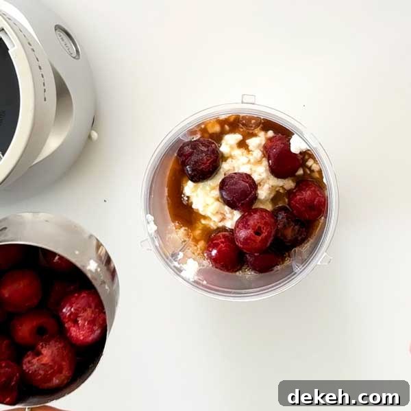 Ice cream ingredients in a nutri-bullet cup.