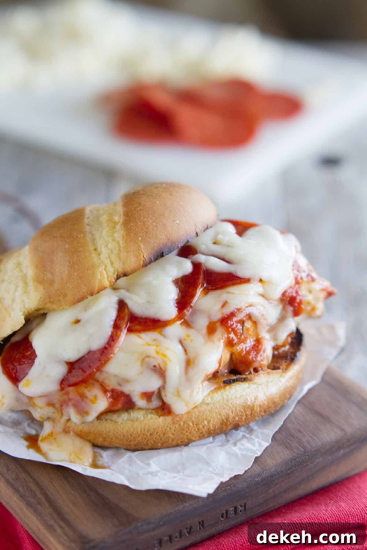 Pizza Topped Grilled Chicken Sandwich on a cutting board
