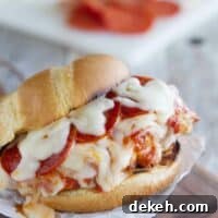 Pizza Topped Grilled Chicken Sandwich on a cutting board