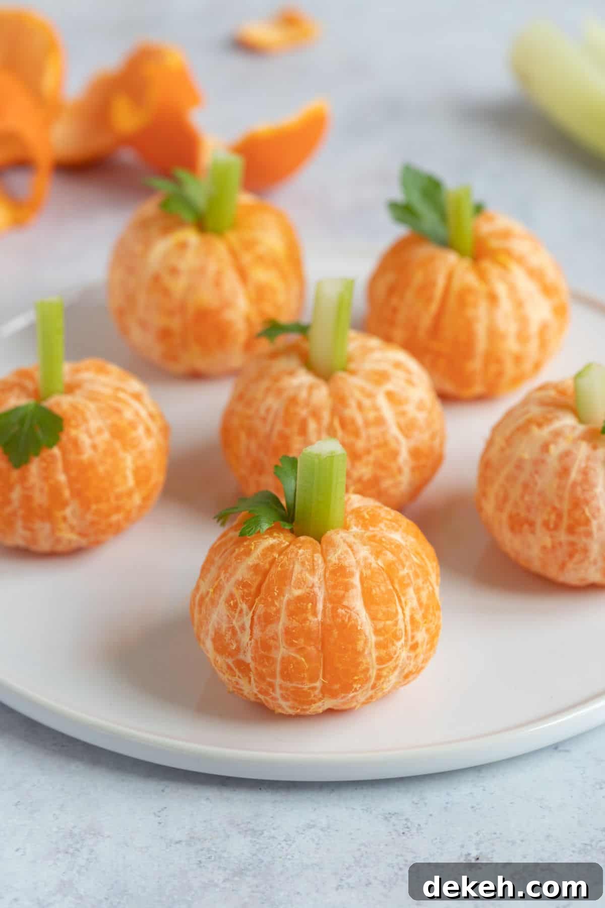A plate of Halloween clementine pumpkins.