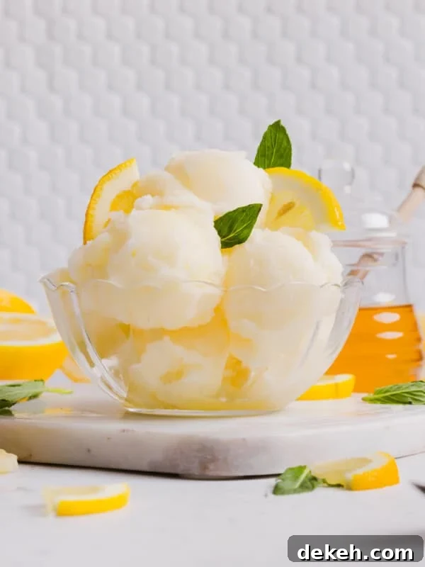 Several scoops of Ninja Creami lemon sorbet in a bowl.
