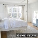 white drapes in an all white bedroom