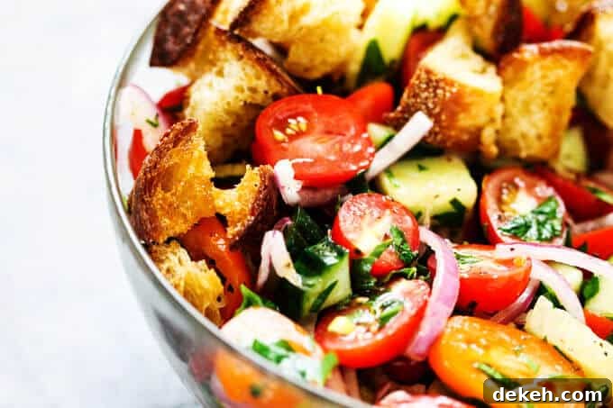 Pnzanella bread salad in a glass bowl