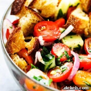 Summer Panzanella with Garlic Butter Bread - this popular Italian salad is a perfect addition to any summer meal or BBQ. Crusty bread that's been infused with garlic butter makes it irresistible.