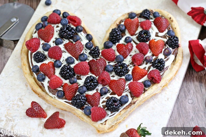 Nutella Puff Pastry Pizza is easy and gourmet. You’ll love the combination of buttery puff pastry, Nutella, white chocolate, and juicy fresh berries!