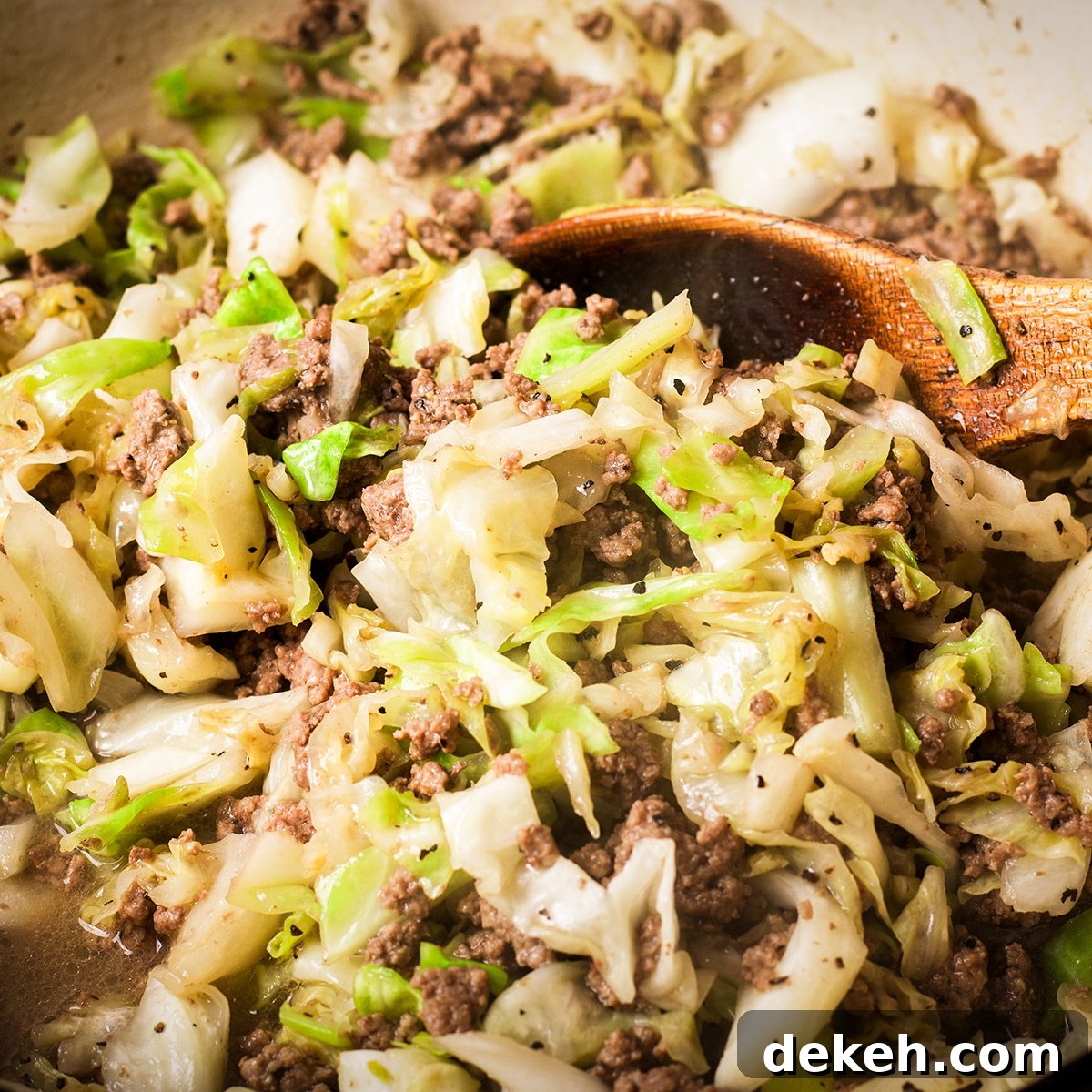 Cooked ground beef and cabbage for krautburgers.
