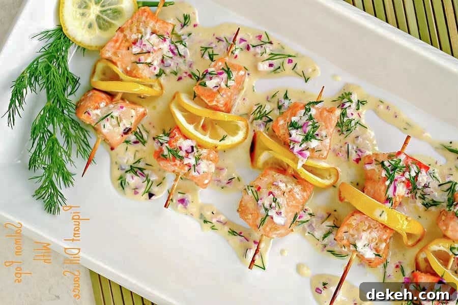 salmon skewers with sauce on a platter