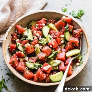 watermelon and feta salad in a bowl with basil and mint