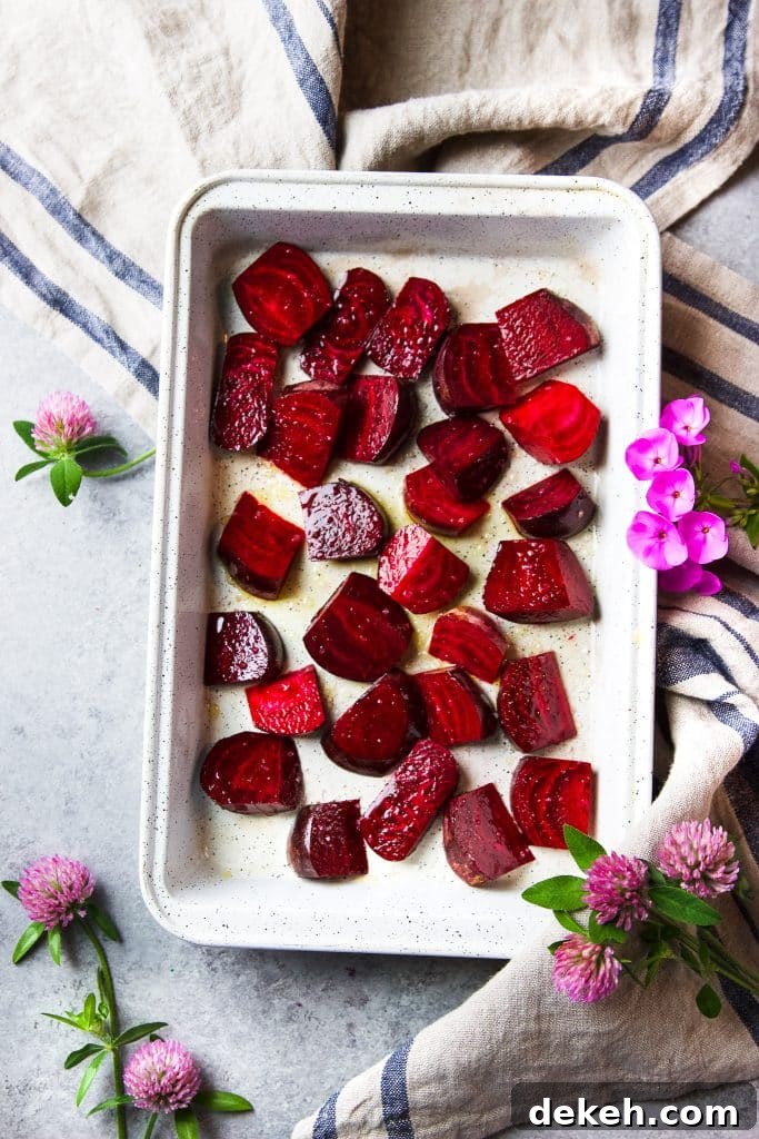 beet chunks in a baking sheet ready to go in oven.