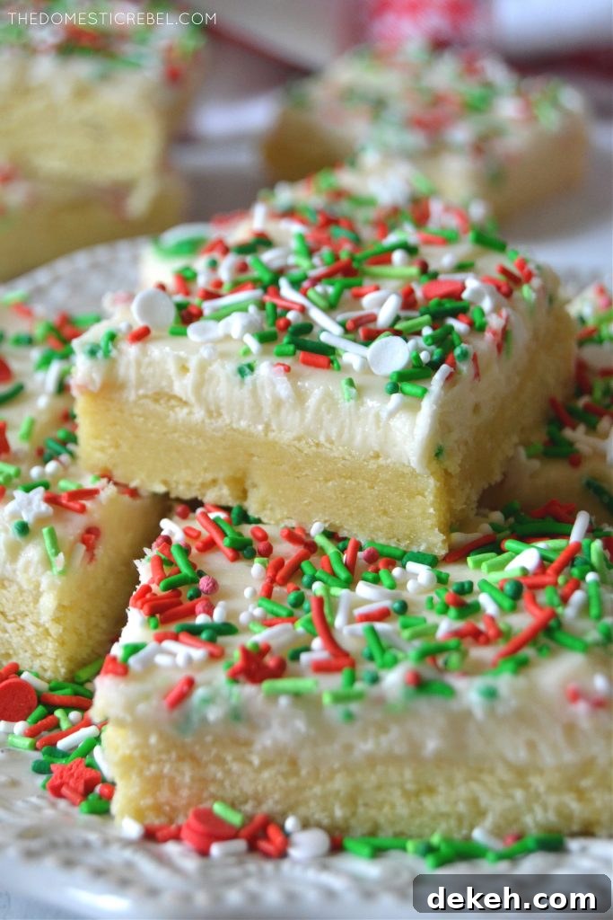 Stack of Christmas Sugar Cookie Bars on a white plate
