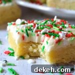 bitten piece of Christmas sugar cookie bar