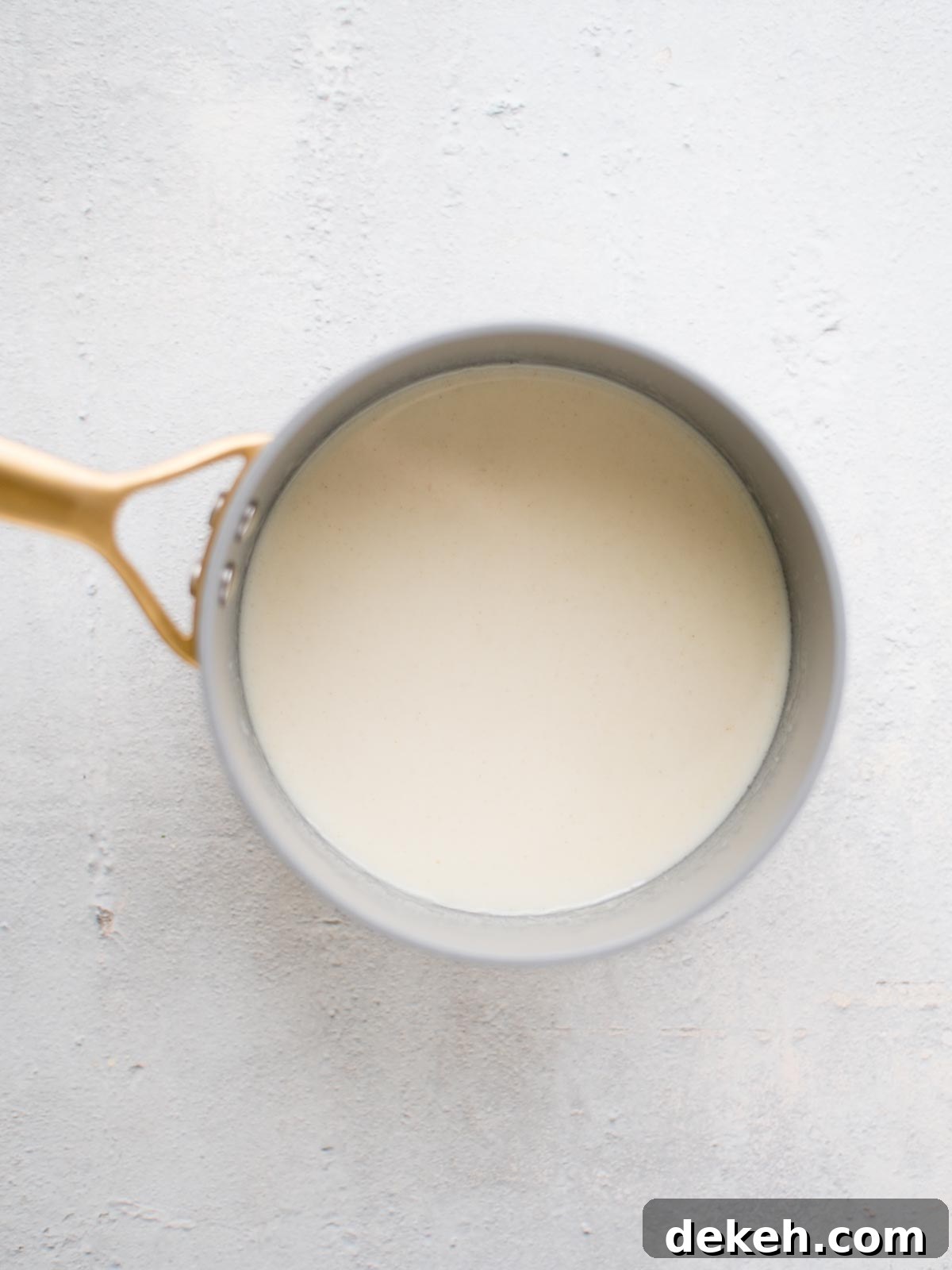 roux with milk and beer in a saucepan