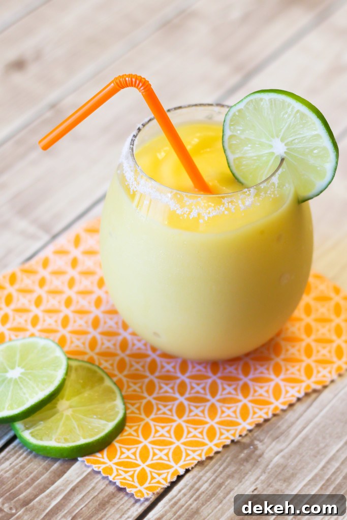 Mango Coconut Margaritas. A refreshing and tropical blended frozen drink!