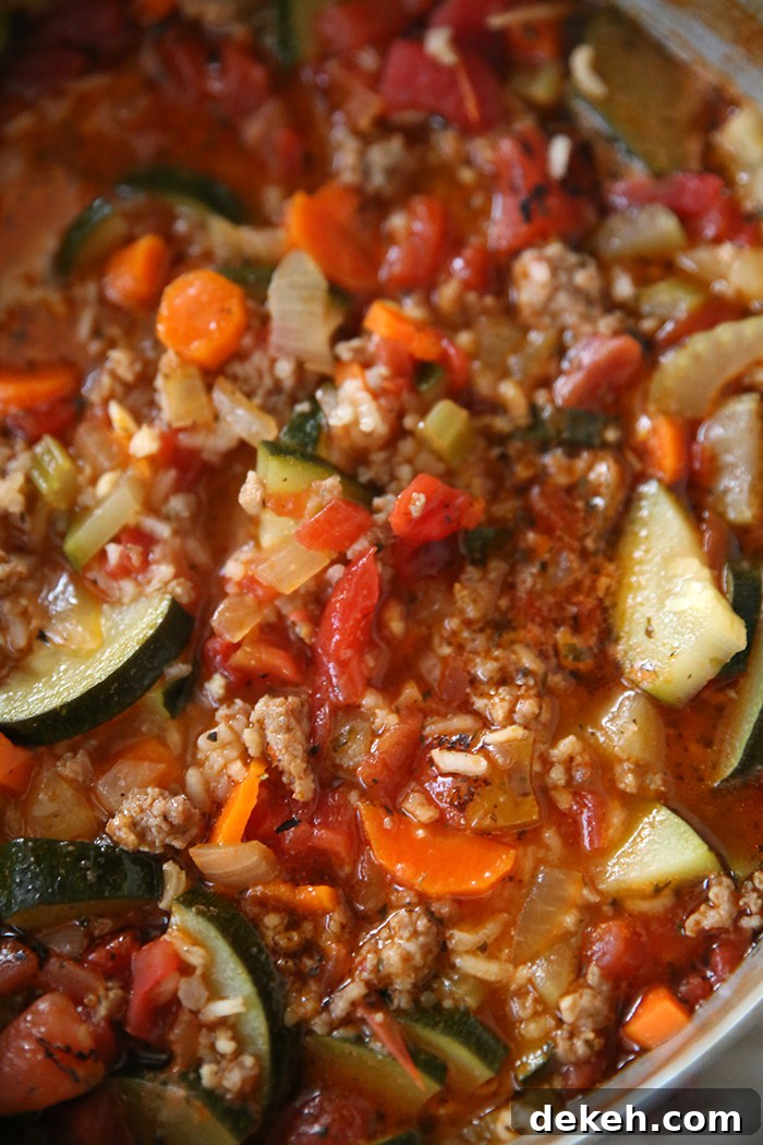 A closeup photo of a large pot full of stuffed zucchini soup.